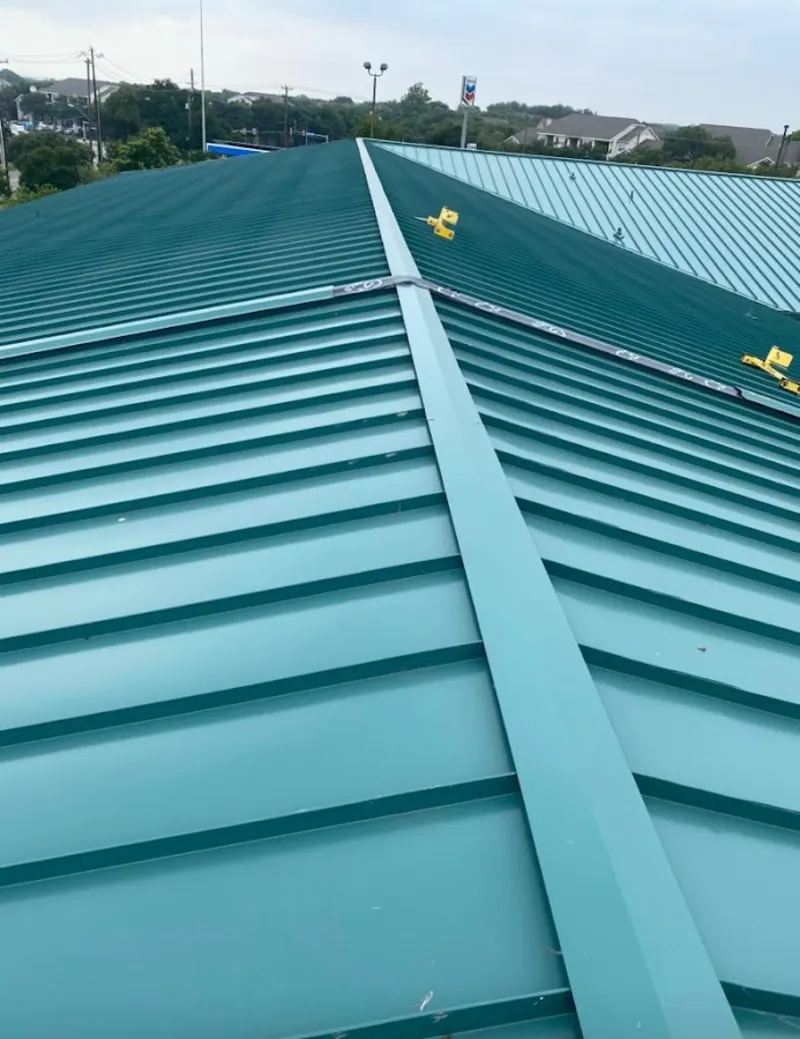 Green commercial metal roof ridge and valley for Metal Roof Repair in Chackbay